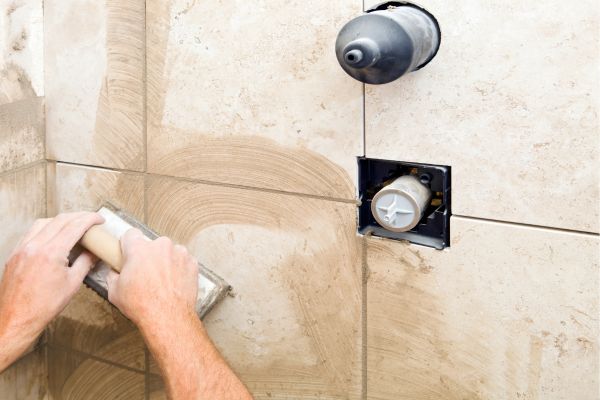 Refreshing the grout in the shower